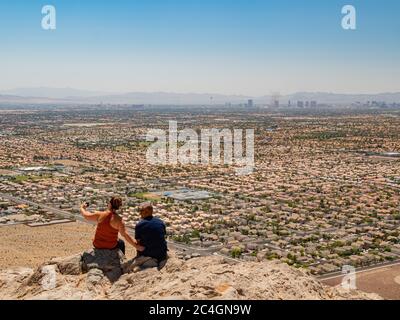 Las Vegas, JUN 7, 2020 -Aerial view of some cityscape from Lone Mountain with two people Stock Photo