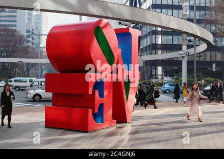 Street in Tokyo's Shinjuku area with a  Robert Indiana 'Love' sculpture. Stock Photo