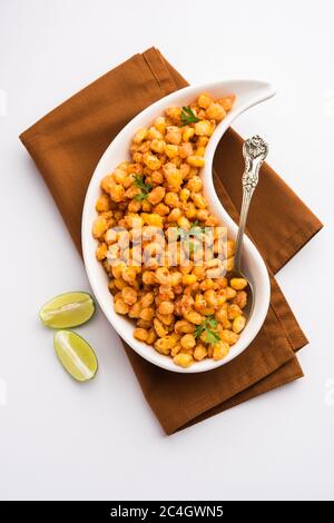 Crispy Fried Corn is a Chatpata starter snack from India, served in a bowl, selective focus Stock Photo