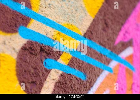 Colorful lines and shapes spray painted on a wall Stock Photo