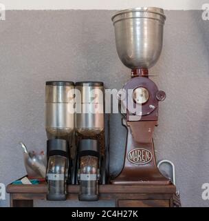 old coffee grinder with coffee beans in closeup Stock Photo