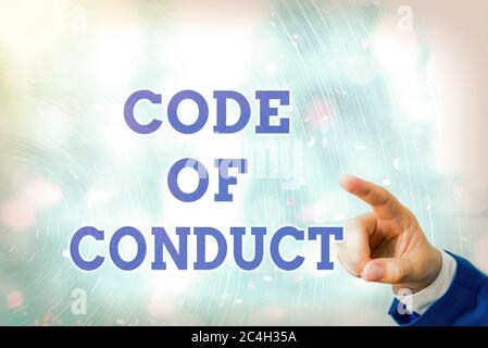 Writing note showing Code Of Conduct. Business concept for set of principles are ethics, respect, code, honesty, and integrity Stock Photo