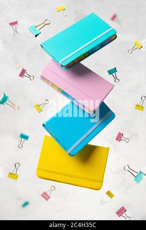 Office supplies stationery levitate over concrete gray background Stock Photo