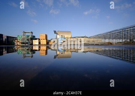 Honselersdijk, the Netherlands, Jan19,2020: Empty and abandoned building construction site closed for coronavirus,cold or due to rain.With reflection Stock Photo