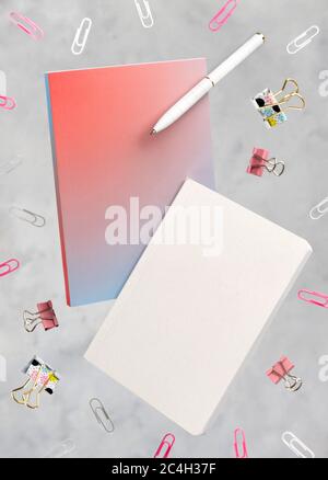 Office supplies stationery levitate over concrete gray background Stock Photo