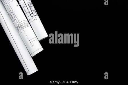Architect workplace top view. Architectural project, blueprints, blueprint rolls on table. Construction background. Engineering tools. Copy space Stock Photo