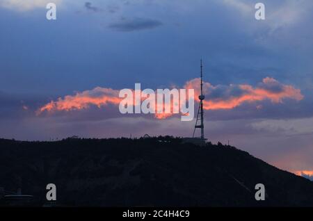 Georgia. TV tower at sunset. The city of Tbilisi. Spring. Stock Photo