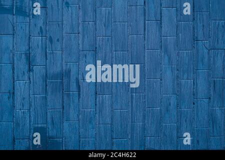 Blue tile background with paint stains, dark wall texture in bathroom. Vintage wallpaper, brick masonry pattern, ceramic floor. Grunge geometric eleme