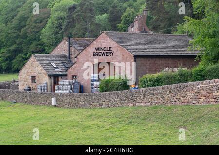 Wincle Brewery with sign, metal cask. Sandstone building with slate roof in Vale Royal