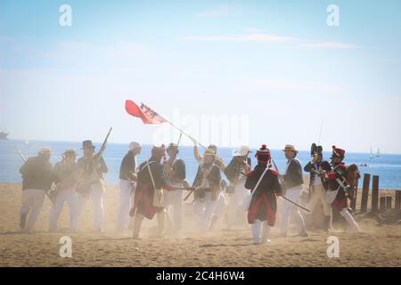 Malaga, Spain - October 26, 2014: 18th century troops of the Royal Navy fight against Napoleonic soldiers. Historical reenactment of the British landi Stock Photo