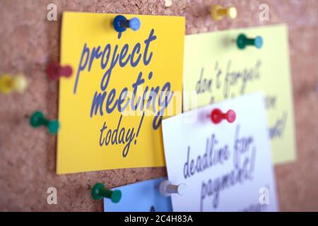 Reminders on board. Corkboard with caution messages. Stock Photo