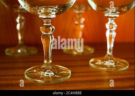 Empty glassware for wine. Beautiful stemglass with decoration and ornaments. Highlighting of contours and shape of glass. Shallow focus Stock Photo