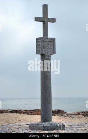 Cape Cross, Namibia - Jan 31, 2016: A memorial stone for Diogo Cao (Can) who landed at this spot in 1485 and who erected a stone cross or padrao at th Stock Photo