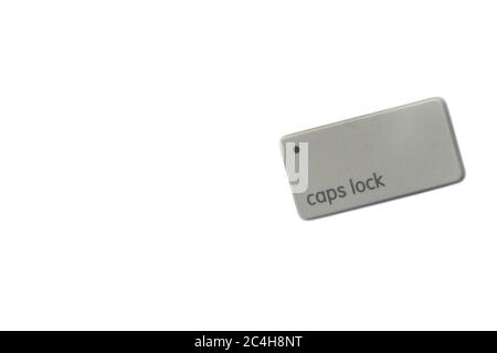 CAPS LOCK button computer keyboard on white background. Holiday and Technology concept Stock Photo
