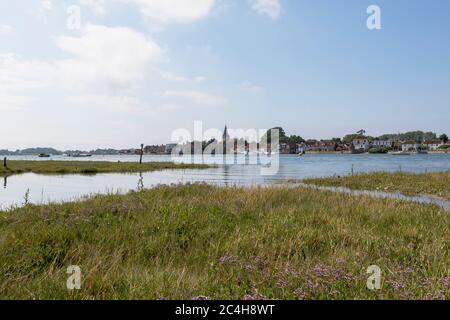 High tide Bosham in West Sussex across Chichester habour on a summers day. View from the flooded road on the south bank of the harbour. Stock Photo
