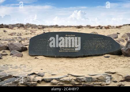 CAPE CROSS, NAMIBIA - JAN 31, 2016: A memorial stone for Diogo Cao who landed at this spot in 1485 and who erected a stone cross or padrao at this spo Stock Photo