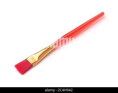Red plastic paintbrush isolated on white Stock Photo