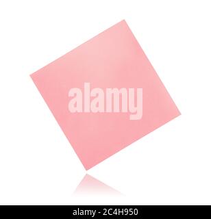 Front view of flying blank pink sticky paper note isolated on white Stock Photo