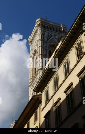 Glimpse of Giotto's bell tower from the streets of the city of Florence, Tuscany, Italy, world heritage site Unesco Stock Photo