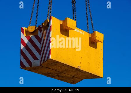 Mobile crane balance weight being lifted into position Stock Photo