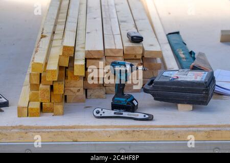 Stack of timber with carpenter's tools and electric drill Stock Photo