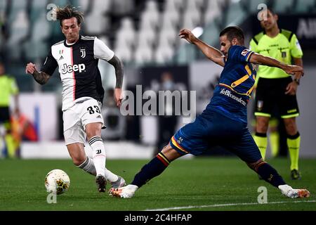 Turin, Italy - 26 June, 2020: Federico Bernardeschi of Juventus FC is tackled by Panagiotis Tachtsidis of US Lecce during the Serie A football match between Juventus FC and US Lecce. Juventus FC won 4-0 over US Lecce. Credit: Nicolò Campo/Alamy Live News Stock Photo