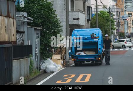 Garbage truck in the street of Tokyo, Japan Stock Photo