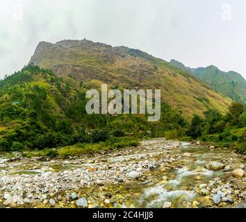 A mountain river, Gushaini, Tirthan Valley, Himachal Pradesh, India Stock Photo