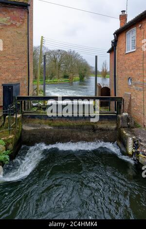 Sluice Gate on River Avon at high water level, Waterside Mill, Downton, Wiltshire, UK Stock Photo