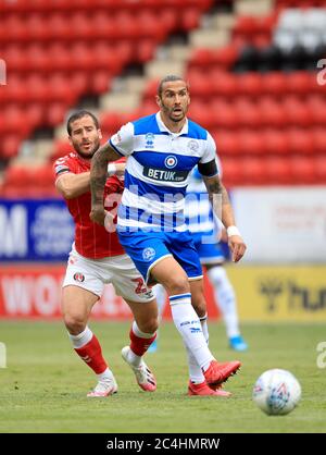 Queens Park Rangers' Geoff Cameron (right) and Charlton Athletic's Tomer Hemed (left) battle for the ball during the Sky Bet Championship match at The Valley, London. Stock Photo