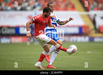 Charlton Athletic's Tomer Hemed (left) and Queens Park Rangers' Geoff Cameron battle for the ball during the Sky Bet Championship match at The Valley, London. Stock Photo