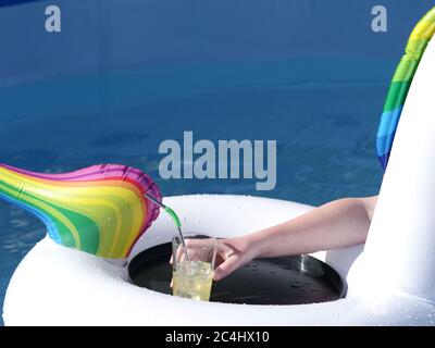 Swimming pool inflatable and drinks tray Stock Photo