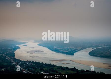 Overlooking Mekong River, Sangkhom. High vantage point of the river in north Thailand from Wat Pha Tak Temple Misty views Landscape format Stock Photo