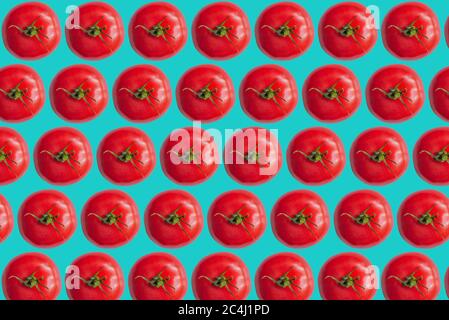 Abstract summer tomato (tomatoes) pattern on a light blue background. Summer minimal background. Stock Photo