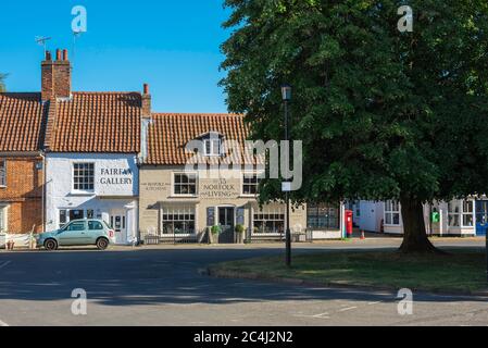 Burnham Market Norfolk, view of a row of traditional shops on The Green in Burnham Market, north Norfolk, UK. Stock Photo