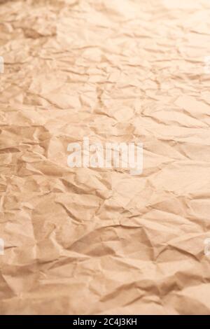 Crumpled brown creased paper. Old wrapping dusty paper. Delivery concept. Selective focus. Vertical view Stock Photo