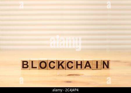 Blockchain word written on wood block. Block chain text on wooden table for your design concept Stock Photo