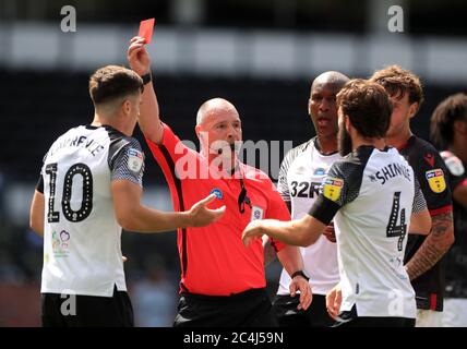Derby County's Tom Lawrence is shown a red card by referee Scott Duncan during the Sky Bet Championship match at Pride Park, Derby. Stock Photo