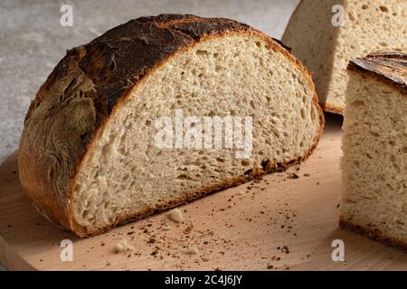 Fresh baked traditional sliced white German farmers bread isolated on white background Stock Photo