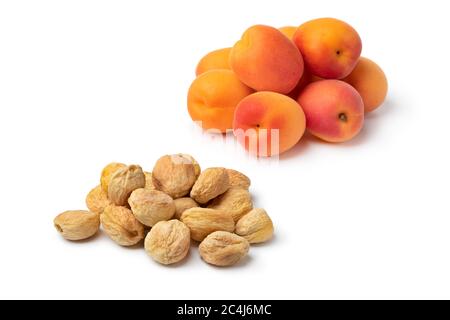 Heap of fresh and dried sweet orange apricots without preservatives isolated on white background Stock Photo