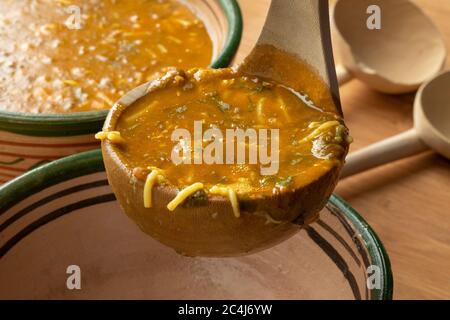 Serving traditional Moroccan harira soup close up for iftar in ramadan Stock Photo