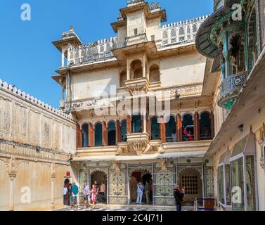 Visitors in Mor Chowk (Peacock Courtyard) in the City Palace, Old City, Udaipur, Rajasthan, India Stock Photo