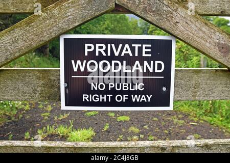 Sign for private woodland no public right of way in Scotland. This is not enforceable due to the right to roam in Scotland. Stock Photo