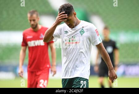 Bremen, Germany. 27th June, 2020. Football: Bundesliga, Werder Bremen - 1st FC Cologne, 34th matchday. Werder's Theodor Gebre Selassie goes into half-time. Credit: Carmen Jaspersen/dpa - IMPORTANT NOTE: In accordance with the regulations of the DFL Deutsche Fußball Liga and the DFB Deutscher Fußball-Bund, it is prohibited to exploit or have exploited in the stadium and/or from the game taken photographs in the form of sequence images and/or video-like photo series./dpa/Alamy Live News Stock Photo