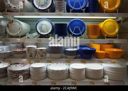 Dishes And Bowls Stacked For Sell At A Shop . Different Selections Of Plates In Sale In Front Of The Shop. Selections Have Different Prices. Varieties Stock Photo