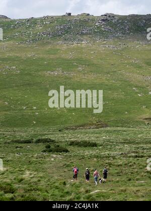 group of hikers heading for Roughtor on Bodmin Moor, Cornwall, UK Stock Photo