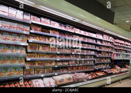 Meat, Supermarket, Butcher. Packets Of Meat At The Supermarket. Meat Aisle In Supermarket. Packaged Meats In Supermarket Refrigerated Section. Bacon, Stock Photo