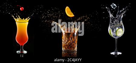 set of cocktail glasses splashing on black background Stock Photo