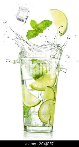 lime and mint falling into a splashing mojito cocktail isolated on ...