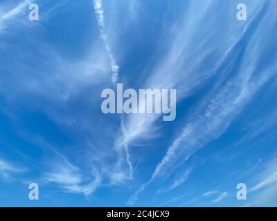 View into blue sky with thin whispy strands cirrus clouds Stock Photo